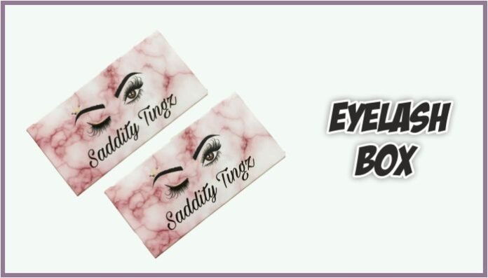 Black printed eyelash boxes on pink material