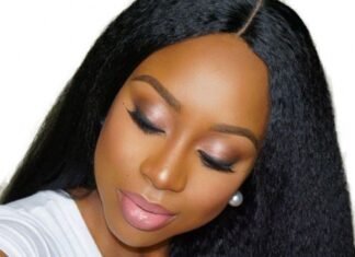 Lace closure wig featuring straight, dark brown hair